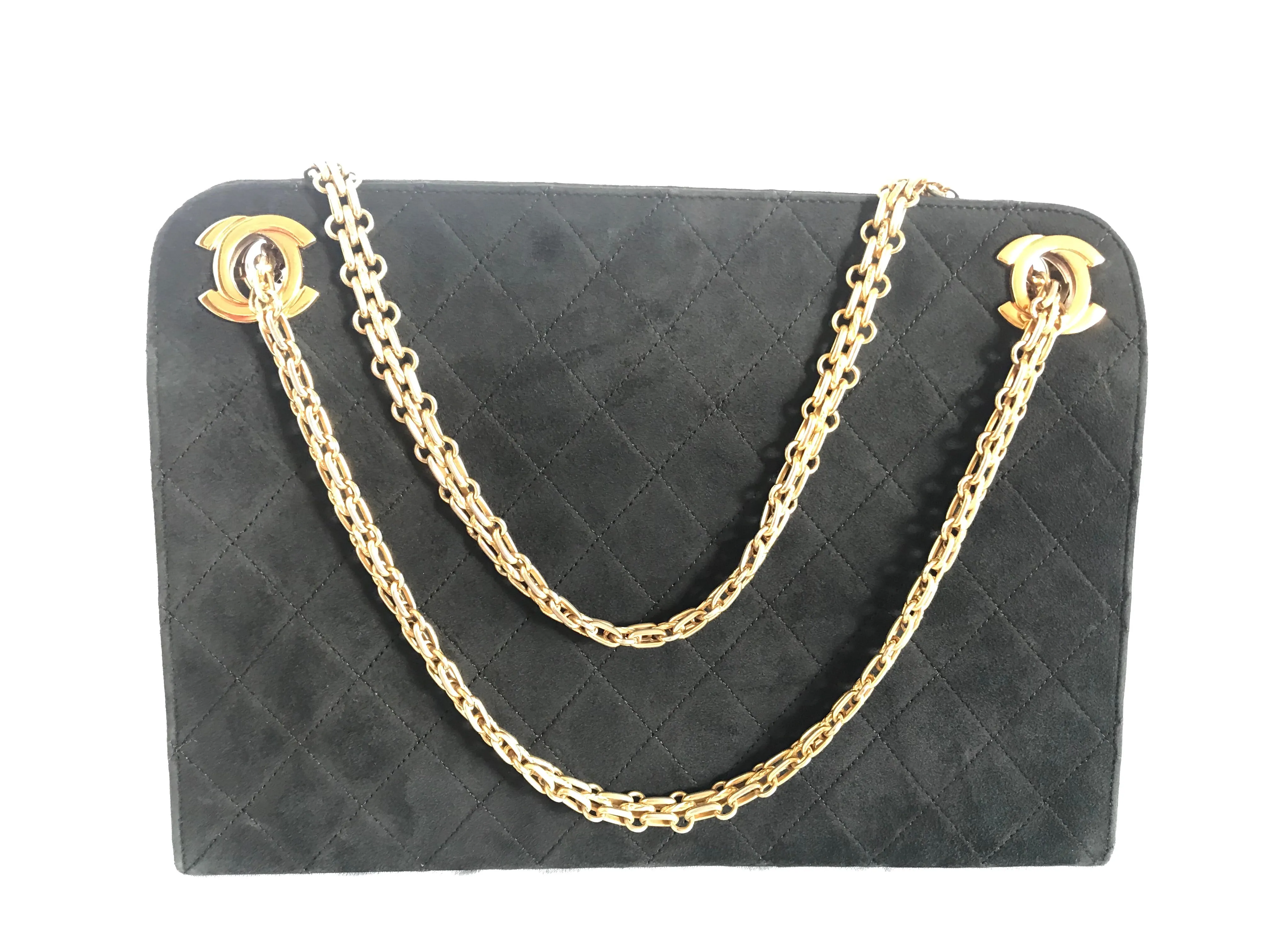 70's, 80's Vintage CHANEL genuine black suede leather kiss lock closure shoulder bag with gold tone CC marks and skinny chains. Rare purse.