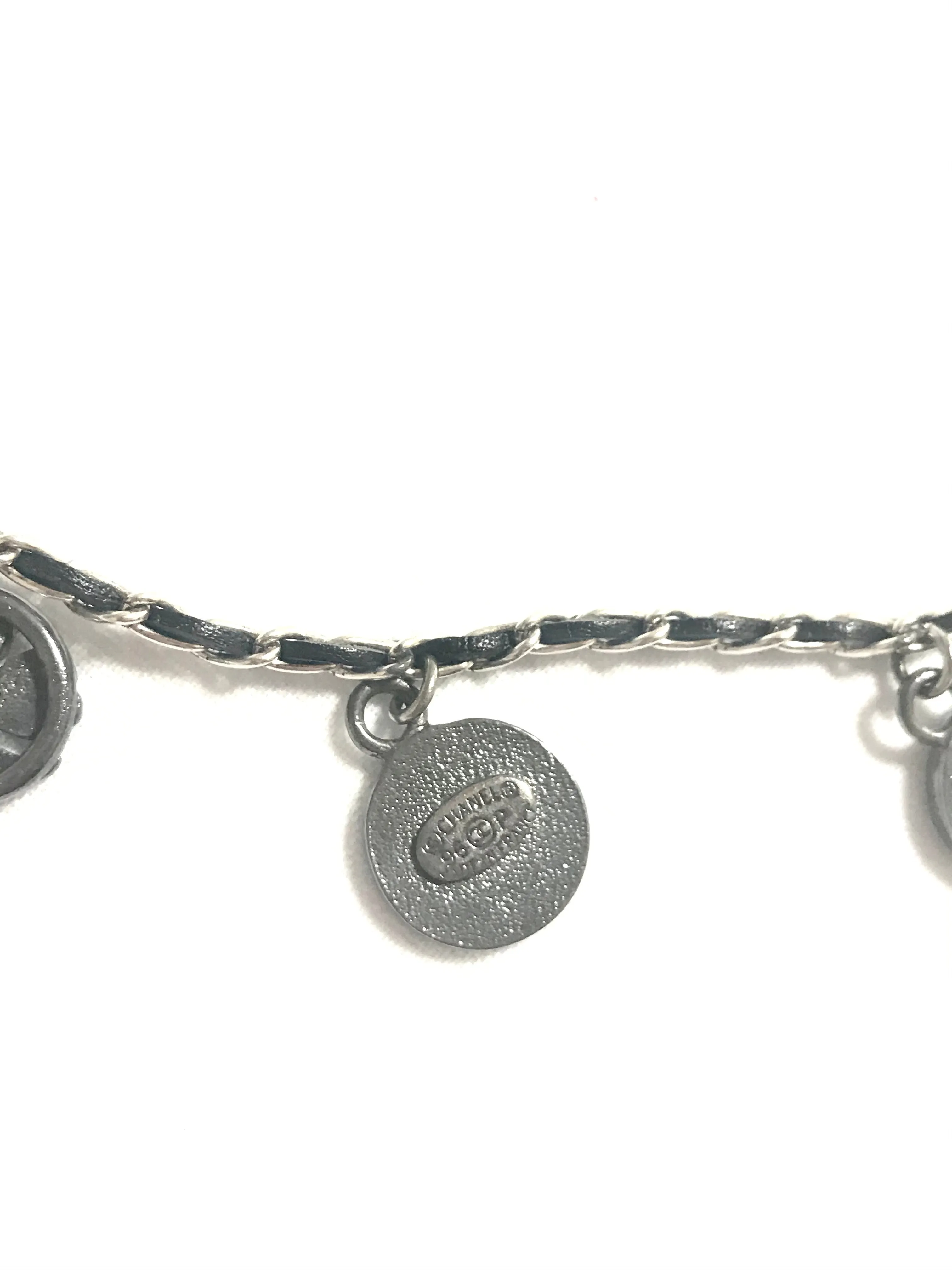 MINT. Vintage CHANEL skinny silver chain necklace with symbolic coin charms and black leather. Can be bracelet too. 060531r1