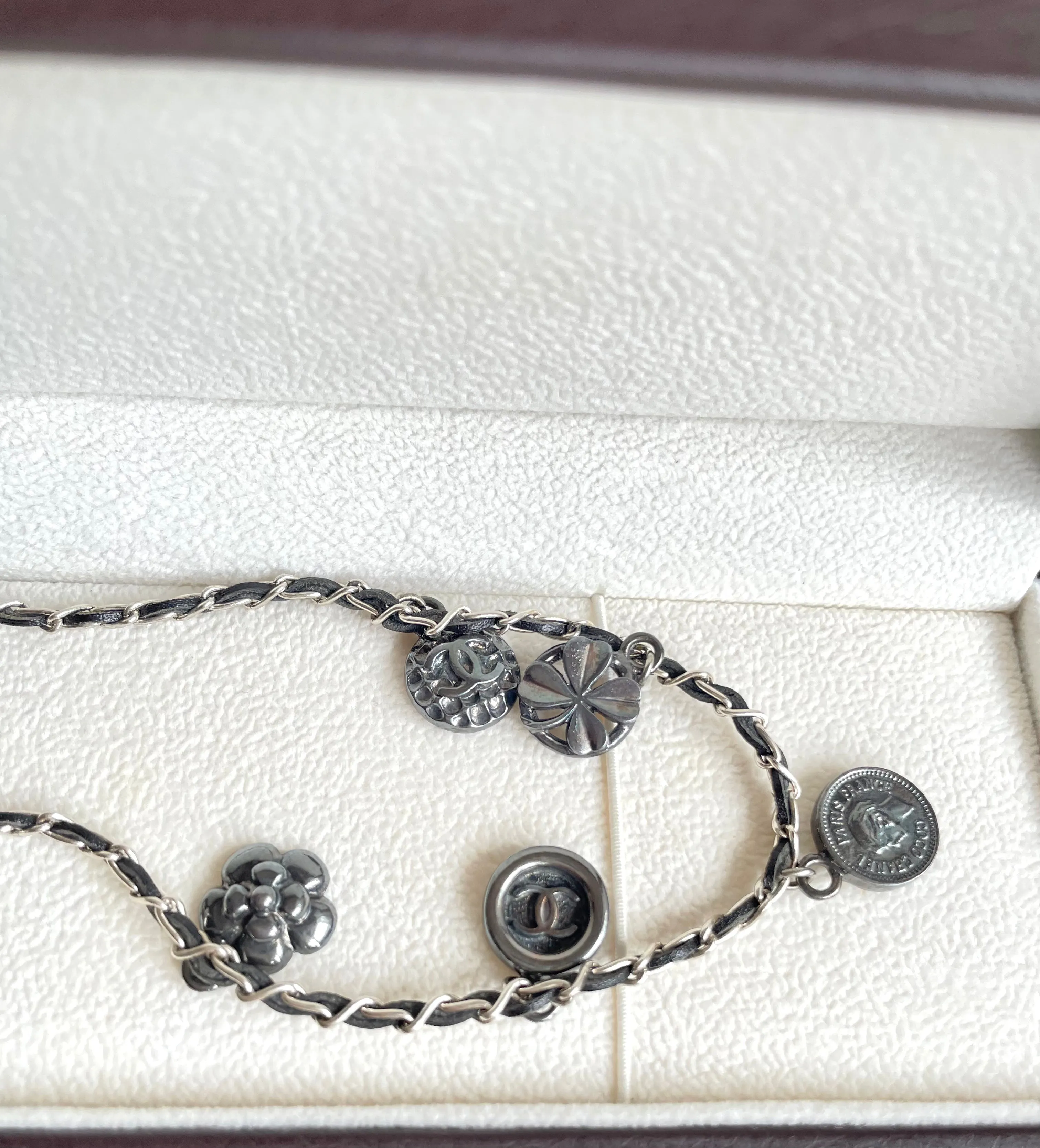 MINT. Vintage CHANEL skinny silver chain necklace with symbolic coin charms and black leather. Can be bracelet too. 060531r1