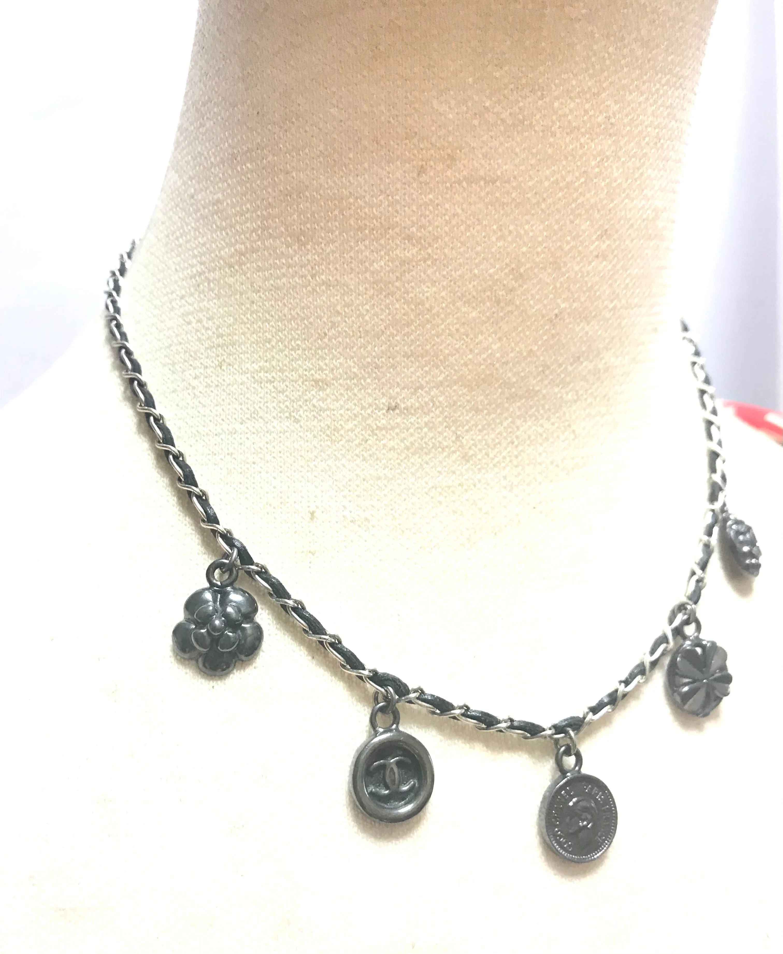 MINT. Vintage CHANEL skinny silver chain necklace with symbolic coin charms and black leather. Can be bracelet too. 060531r1