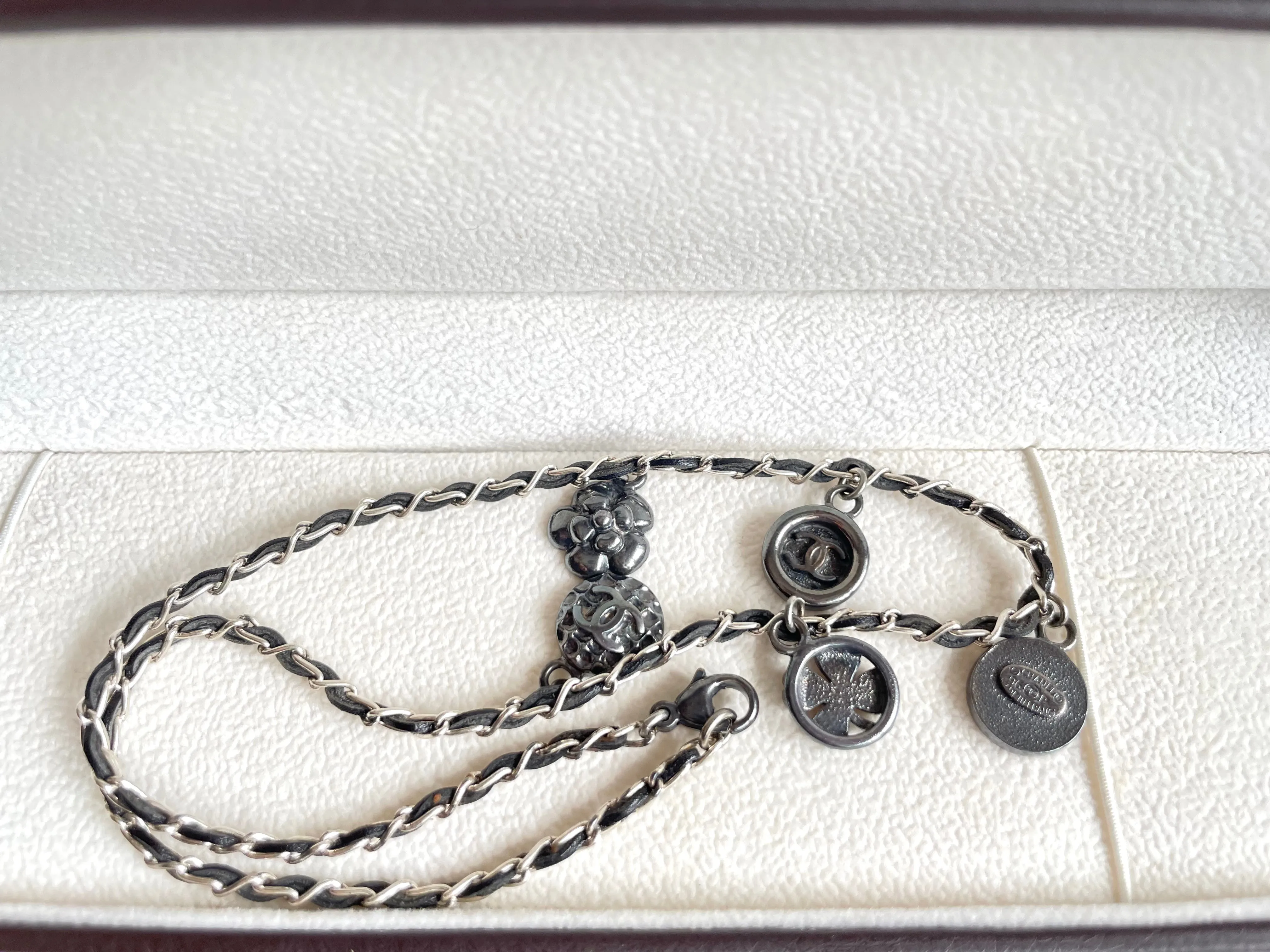 MINT. Vintage CHANEL skinny silver chain necklace with symbolic coin charms and black leather. Can be bracelet too. 060531r1