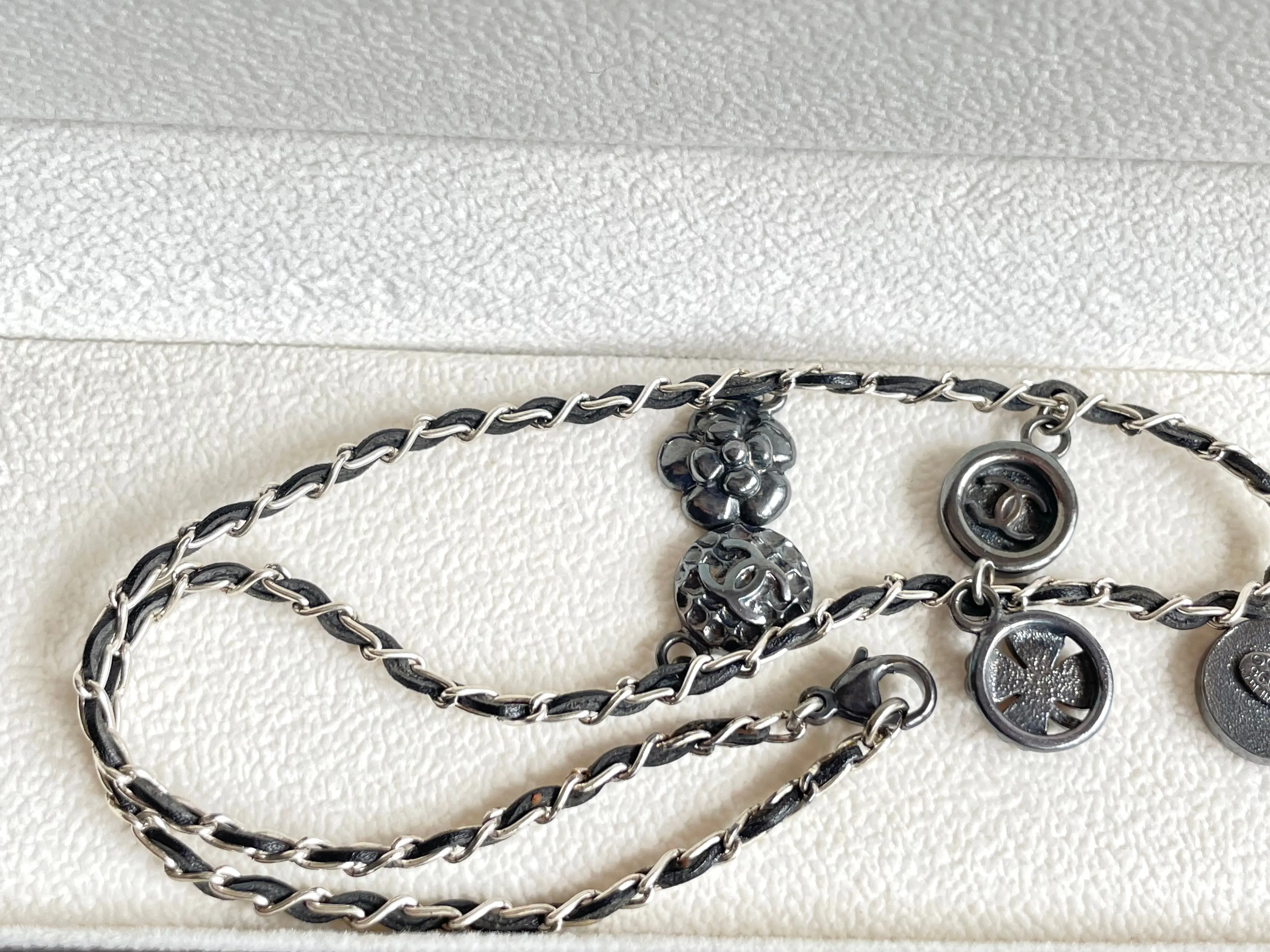 MINT. Vintage CHANEL skinny silver chain necklace with symbolic coin charms and black leather. Can be bracelet too. 060531r1