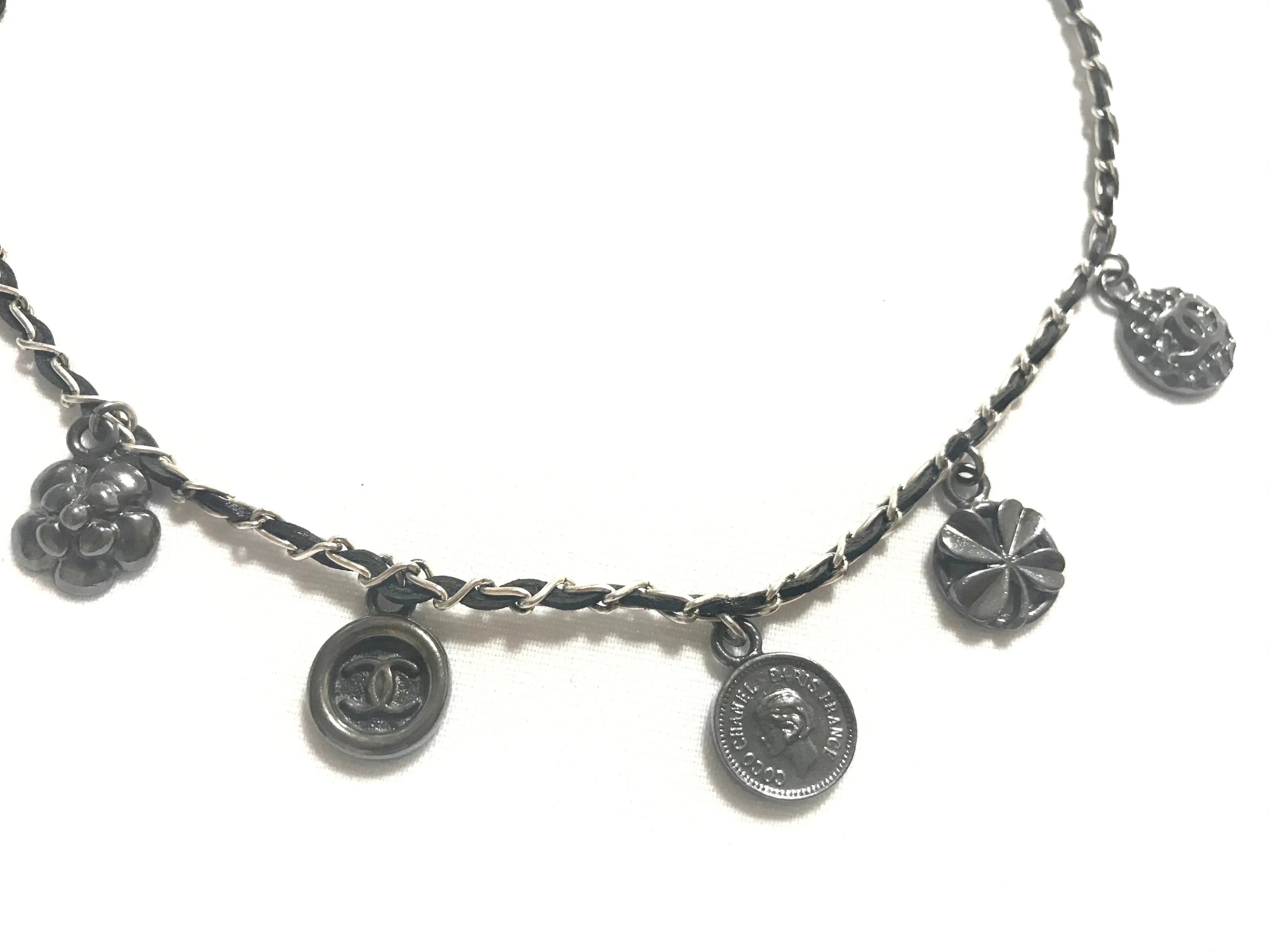 MINT. Vintage CHANEL skinny silver chain necklace with symbolic coin charms and black leather. Can be bracelet too. 060531r1