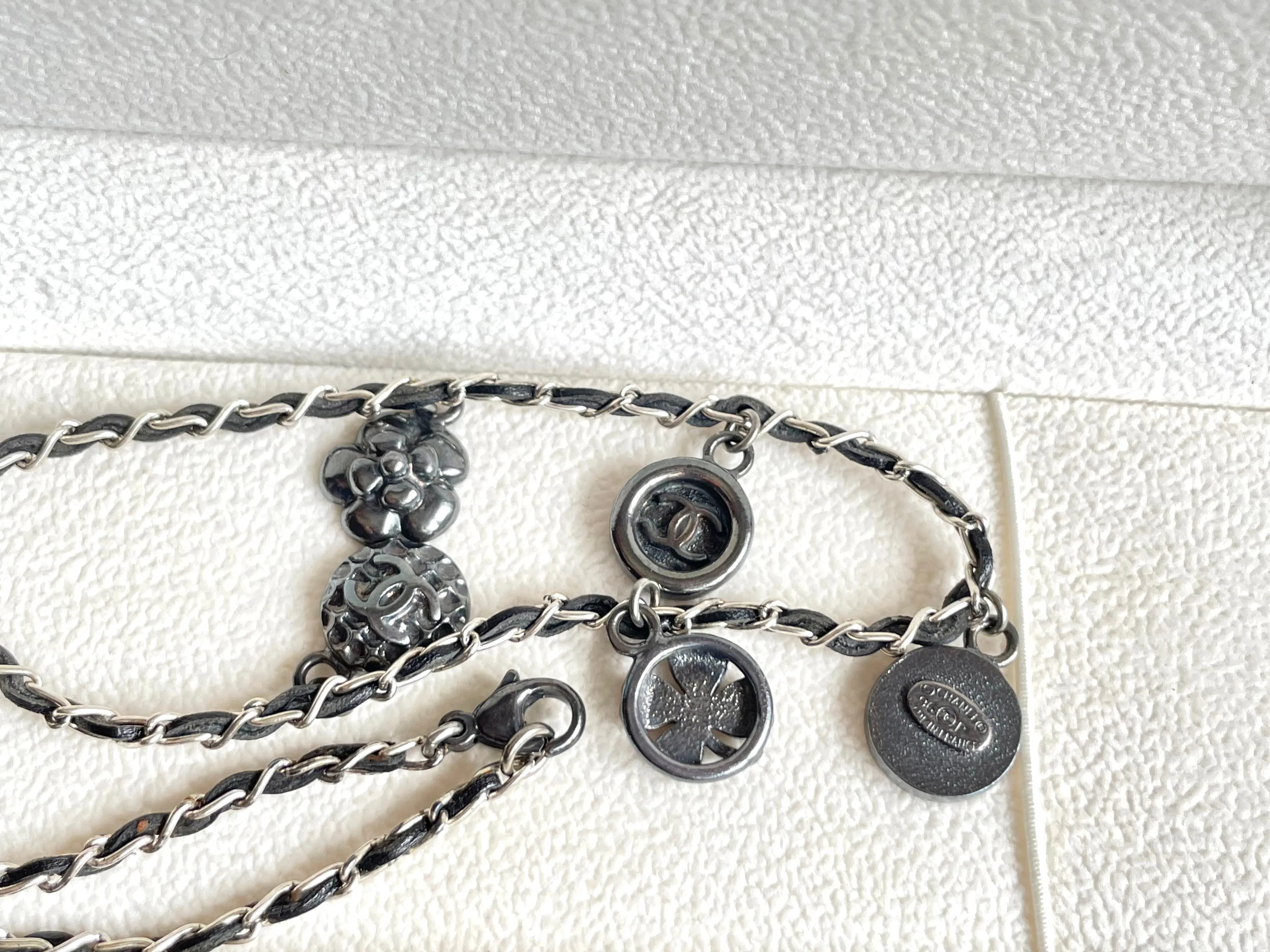 MINT. Vintage CHANEL skinny silver chain necklace with symbolic coin charms and black leather. Can be bracelet too. 060531r1