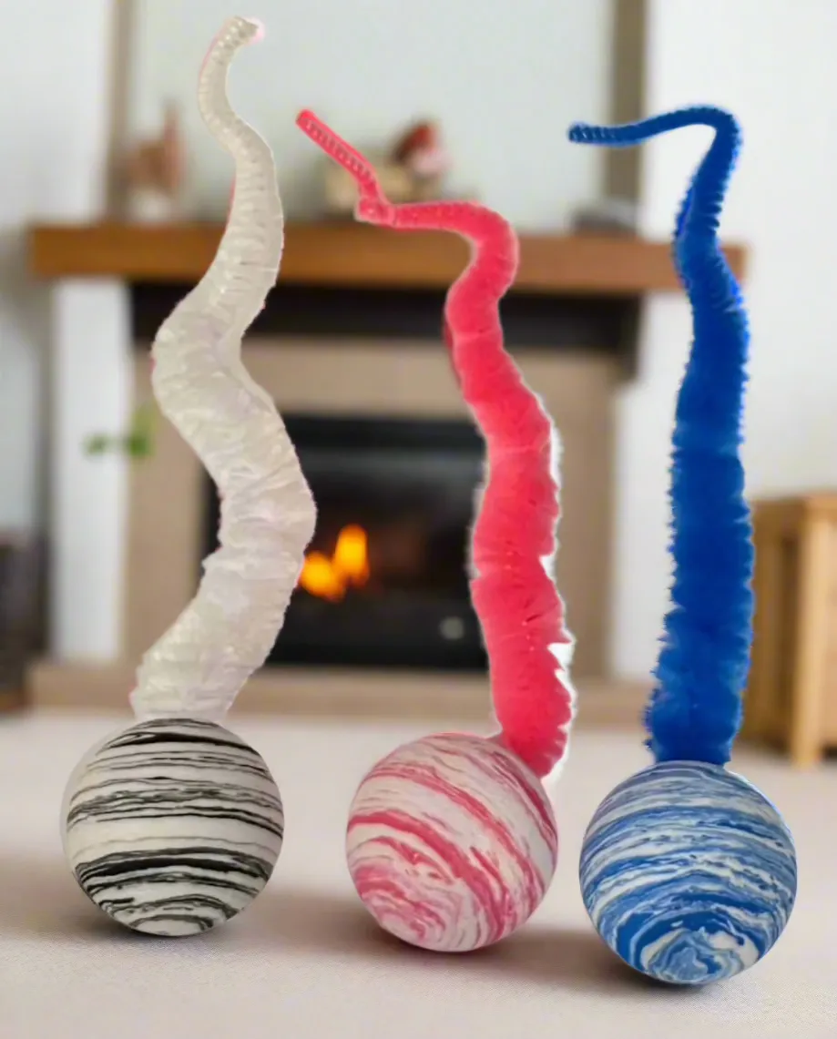 Striped Two Tone Rubber Ball with Caterpillar Style Tail attached - Black, Pink, or Blue